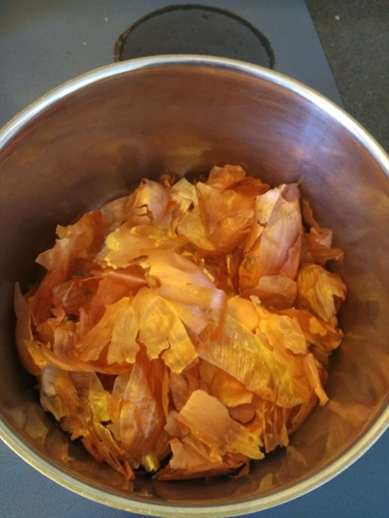 onion skins in pot to use for dyeing fabric