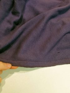 Seam sewn with lightening stitch and serged edge