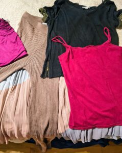clothing swap clothes on a bed